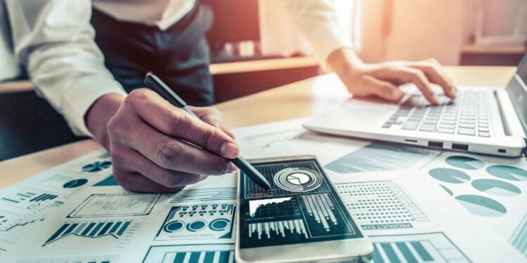 Businessman analyze data of stock market research.